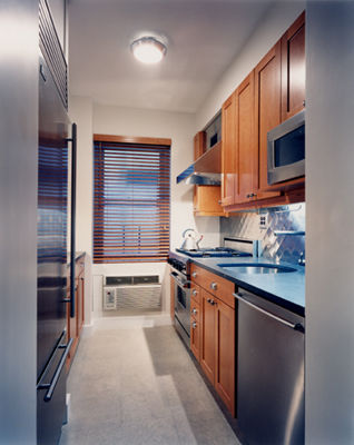 kitchen with quilted stainless steel backsplash